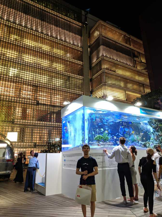 Ginza Sony Park: Me clutching my new Uniqlo purchases next to an aquarium in
a park that we happened to walk past.