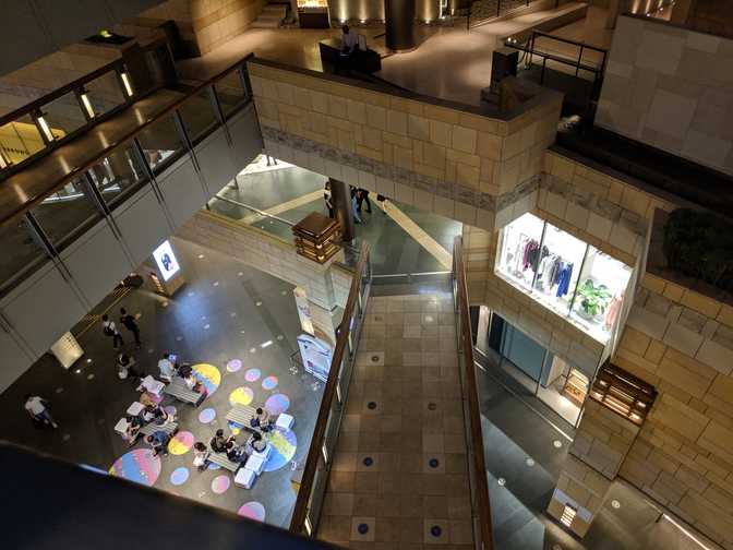 West Walk, Roppongi Hills: looking down into the West Walk. This picture makes
it look like any shopping center here, but it doesn't really capture the
ambiance of the wide open spaces lighting, and expensive shopping.