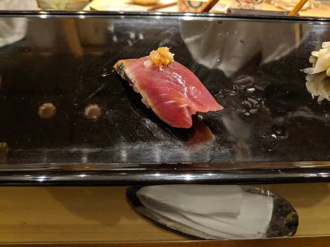 Katsuo, which the chef translated as skipjack tuna but is also often
translated to bonito, a related but different fish. He asked me if I was okay
with garlic and I said yes, although I'm pretty sure what I ate was ginger since
it tasted like it, and I overhead another chef translating it as ginger.