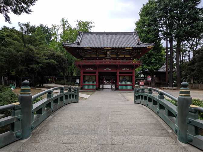 I came from the back left of the picture, but I came here to take a picture
from the front. Just to the left of the frame were some gardeners toiling in the
humidity.