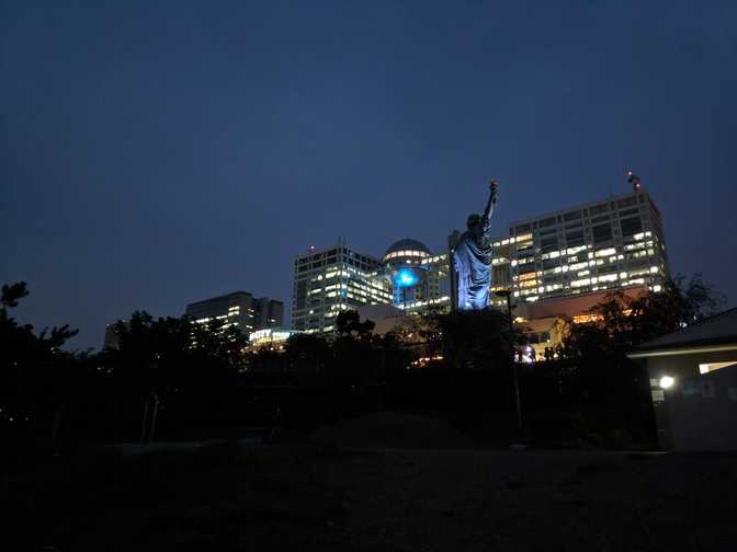 A replica Statue of Liberty. Behind it is some crazy looking mall called
Aqua City.