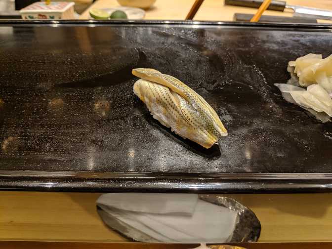 I'd read that kohada (konoshiro gizzard shad) is a sushi classic, and a good
way to gauge the ability of the restaurant since it takes a lot of preparation
and can spoil easily, but is supposed to be amazing when it's done right. I'm
pretty sure that I've only had this fish for sushi one other time, so needless
to say I haven't quite acquired a taste for it since it's one of those sardine
family fish. I didn't find this piece to be anything noteworthy, although it
wasn't bad either.