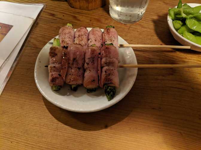 Are the staff speaking Mandarin? Oh cool, I guess they're Chinese. Which is
lucky for those Chinese travellers that just came in. Also wow, these asparagus
bacon skewers are delicious.