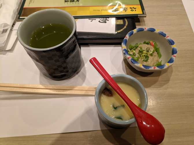 Egg custard and some salad-like appetiser. The custard had a little prawn in
it.