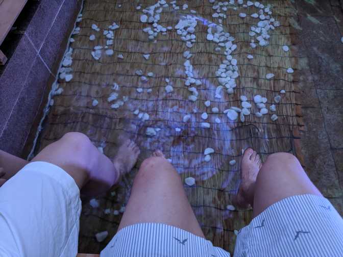 Dipping our feet in. It was actually pretty cool outside, so this would've
been great on a hotter day. We didn't buy towels so we just let our feet mostly
dry naturally before wiping off with a pocket tissue.