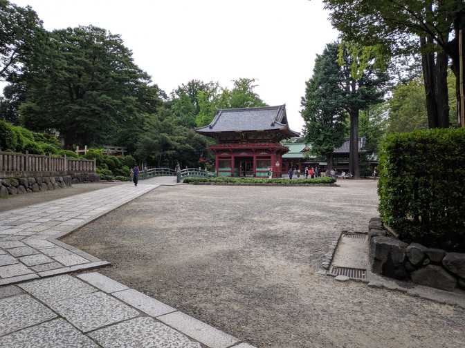 The view from near the front entrance. You can see the bridge, the torii
path, the big gate, the wall/gate behind it, and the temple
itself.