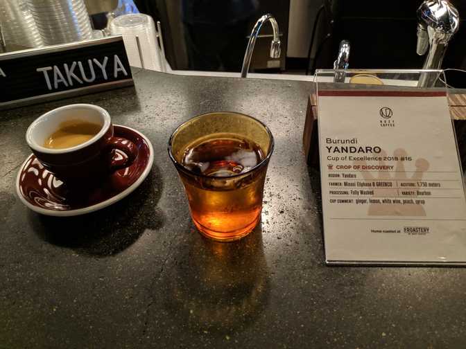 A great espresso, brewed by barista Takuya. When he saw that I was taking a
photo, he moved the information sign for me.