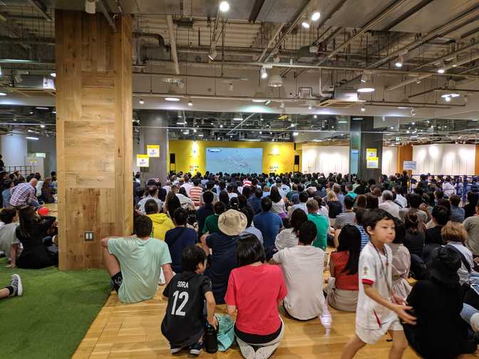 Upstairs was the family floor. No alcohol allowed. Everyone sitting made it
easier to actually see the screen. The space in the front half was a "no
shoes" area.