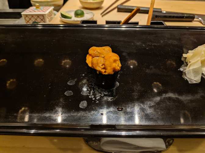 This uni was amazing. Creamy and sweet. I don't have much of a vocabulary to
describe the subtleties of uni flavour and texture. I also keep reading that
the founder of Kyubey invented/popularised this style of sushi called "gunkan
sushi", named for the way its appearance resembles that of a battleship.