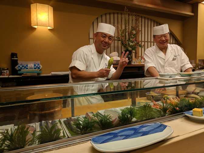 I asked if I could take a picture so he picked up his wasabi stick to pose.
I believe that's the owner-chef on the right laughing at him.