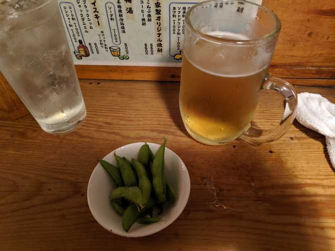 Edamame for our cover charge. I only recently learnt that these are just soy
beans. We also needed to order a drink each.