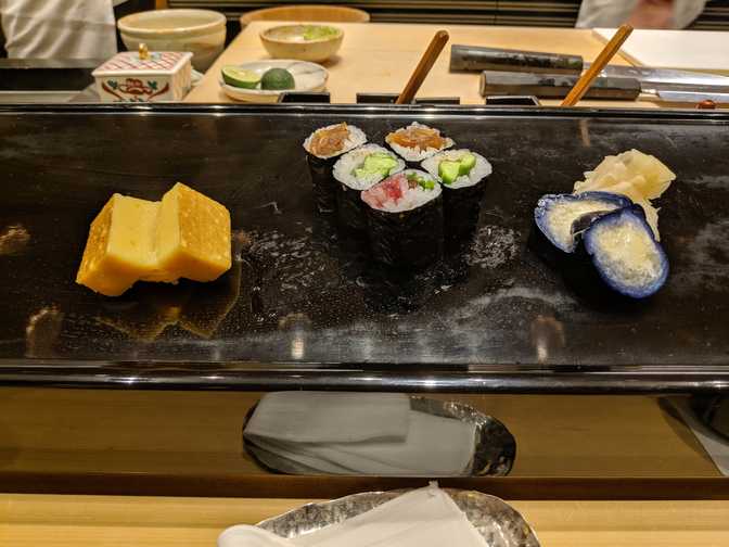 Tamago, which I could choose to have with or without rice. I chose with rice.
It was steaming hot, hotter than I've had anywhere else, and I liked it. It
reminded me of Chinese egg tarts. The eggplant on the right was not bad too,
pickled and somewhat salty.