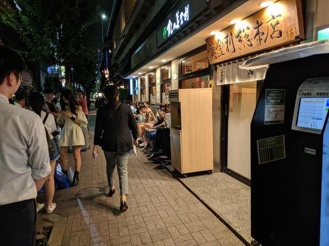 Water for thirsty queuers. I also saw people go in to use the bathroom. Seeing
all of this was when I realised that I should've got a ticket before I did
anything else today.